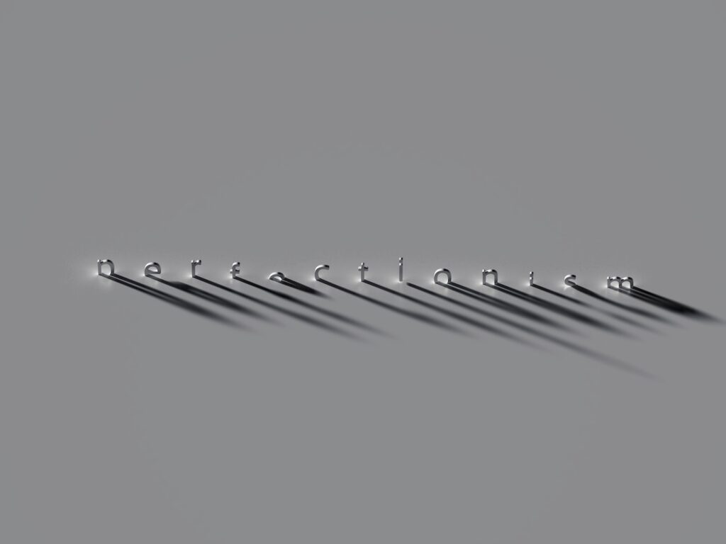 A row of metal hooks on a gray background